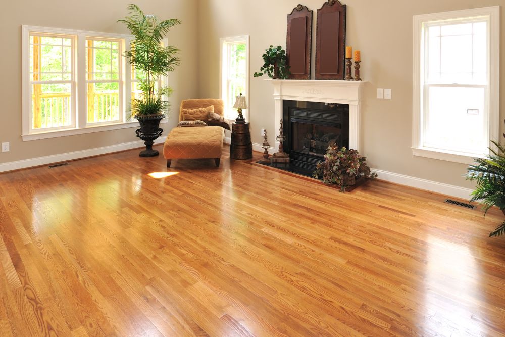 A living room adorned with hardwood floors and a fireplace, emphasizing a warm and inviting ambiance.