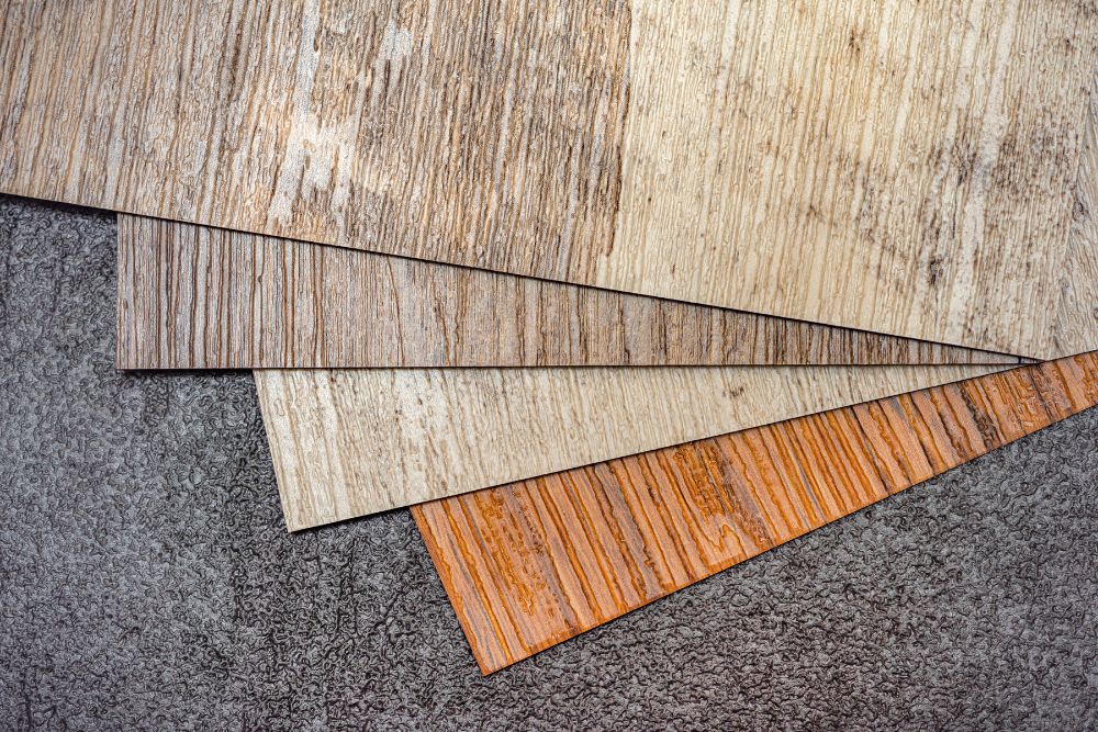 A collection of wood flooring types, illustrating diverse designs and colors, with a focus on luxury vinyl tile in Renton, WA.